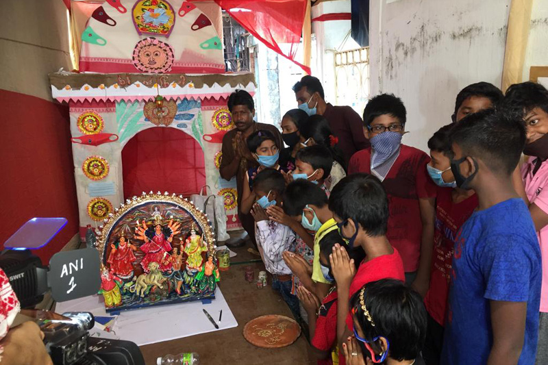 celebreting durga puja with under priviledged children indigenously created by the children